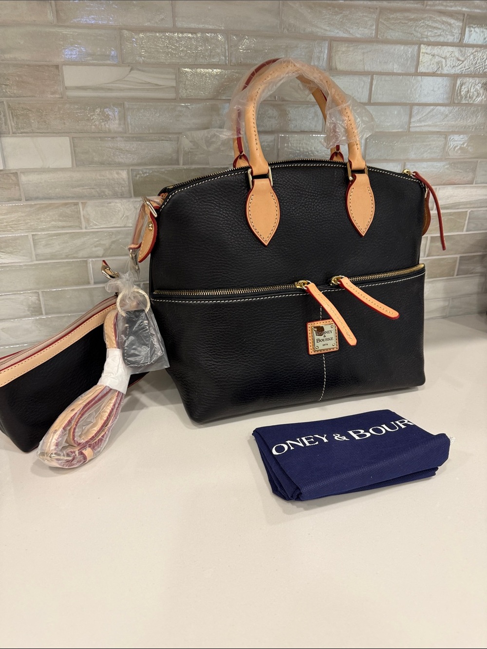 Dooney & Bourke Black Pebble Leather Satchel, Tan Trim and goldtone zippers.